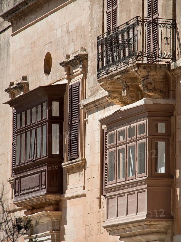 Two balconies made of wood and iron on a historic facade, the town of mdina on the island of malta with historic houses, colourful balconies, magnificent churches, mdina, Malta, Europe