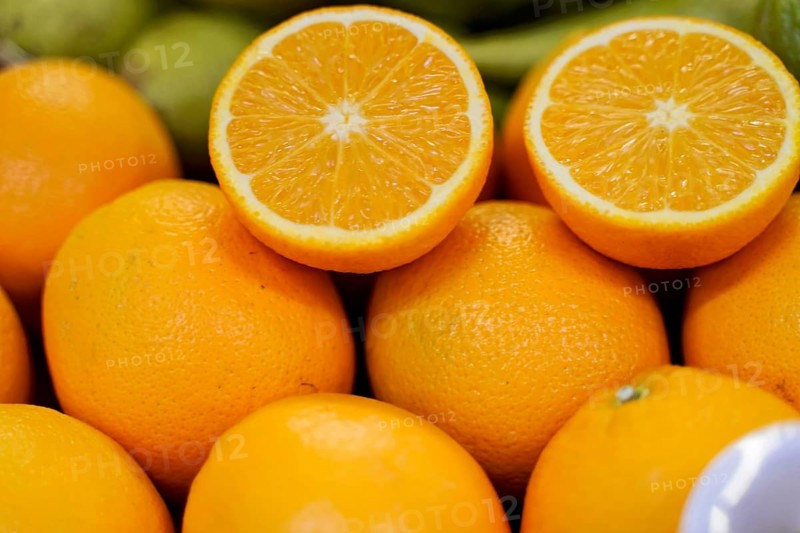 Market hall, Mercado de Nuestra Senora de Africa, Santa Cruz de Tenerife, Tenerife, Canary Islands, Spain, Europe, Close-up of whole and sliced oranges showing their juicy texture, Europe