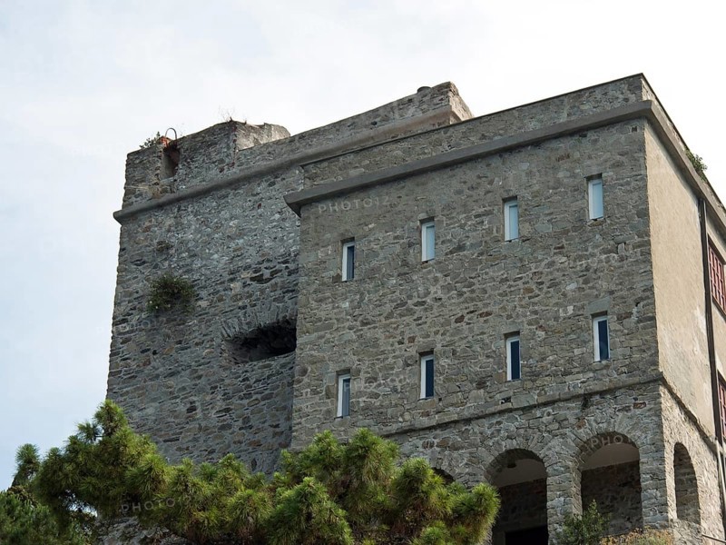 Old, historic building with stone walls and castle tower, surrounded by vegetation, Bari, Italy, Europe