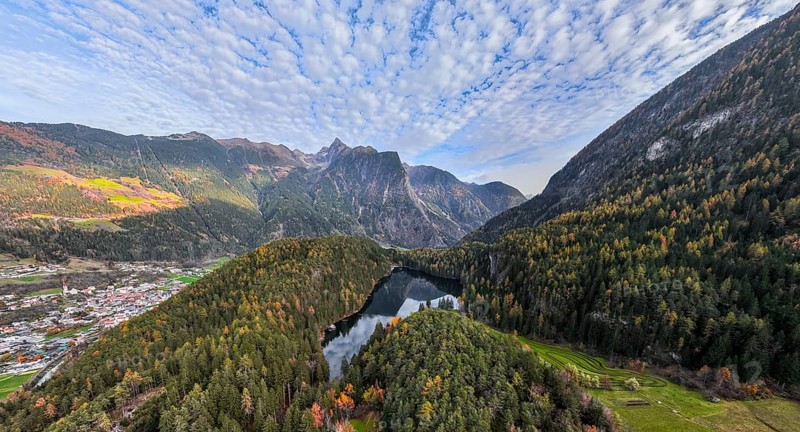 Aerial view, mountain peaks of the Oetztal Alps reflected in Lake Piburger See, in autumn, near Oetz in Oetztal, Tyrol, Austria, Europe