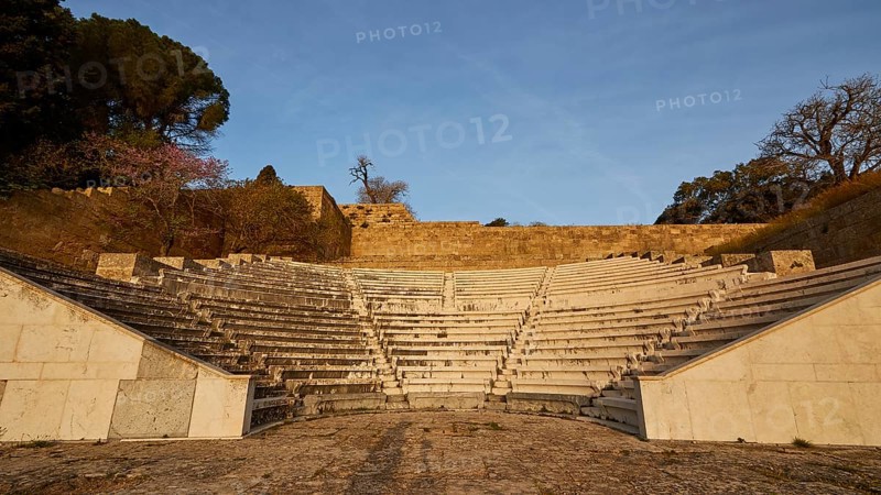 Ancient amphitheatre with stone seating steps, captured in the morning light, Archaeological site, Rhodes Town, Rhodes, Dodecanese, Greek Islands, Greece, Europe