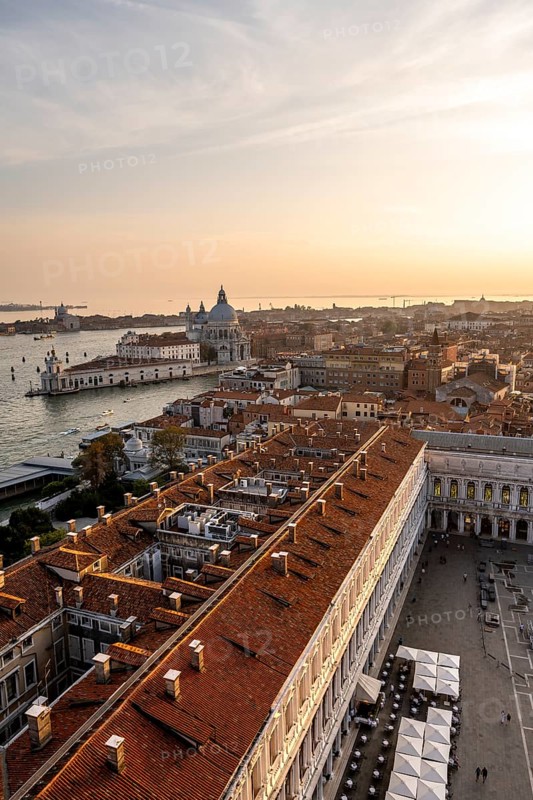 St Mark's Square and Basilica di Santa Maria della Salute on the Grand Canal at sunset, view from the Campanile di San Marco bell tower, city view of Venice, Veneto, Italy, Europe