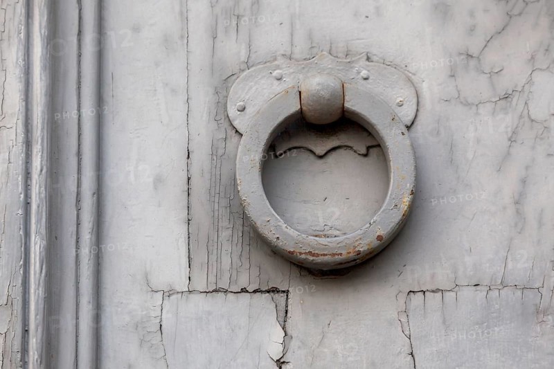 Door knocker on an old wooden door, Rome, Italy, Europe