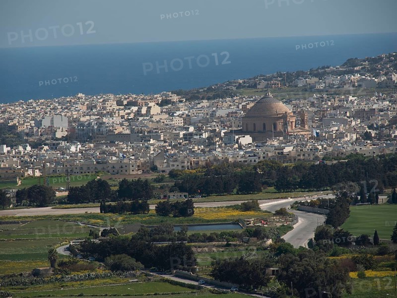 Panoramic view of a town near the sea with a striking dome and mediterranean buildings, the town of mdina on the island of malta with historic houses, colourful balconies, magnificent churches, mdina, Malta, Europe