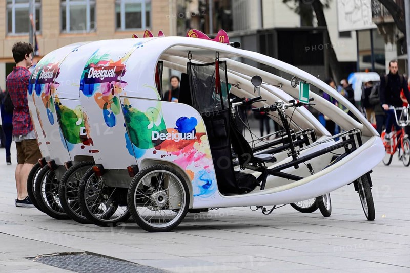 Barcelona, Catalonia, Spain, Europe, A colourfully painted bicycle tricycle for tourists in a city, Europe