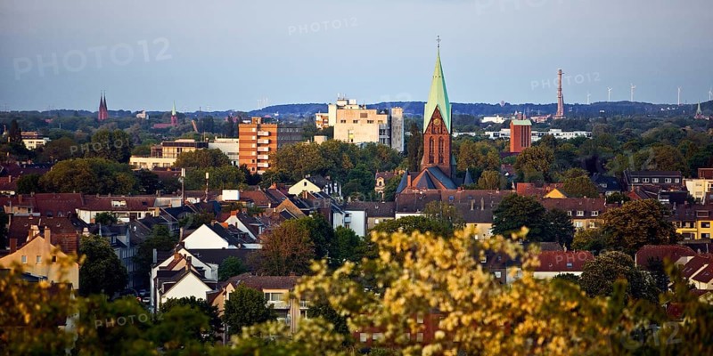 View from the Pluto spoil tip to Wanne-Eickel with the church tower of St Laurentius, Herne, Ruhr area, North Rhine-Westphalia, Germany, Europe