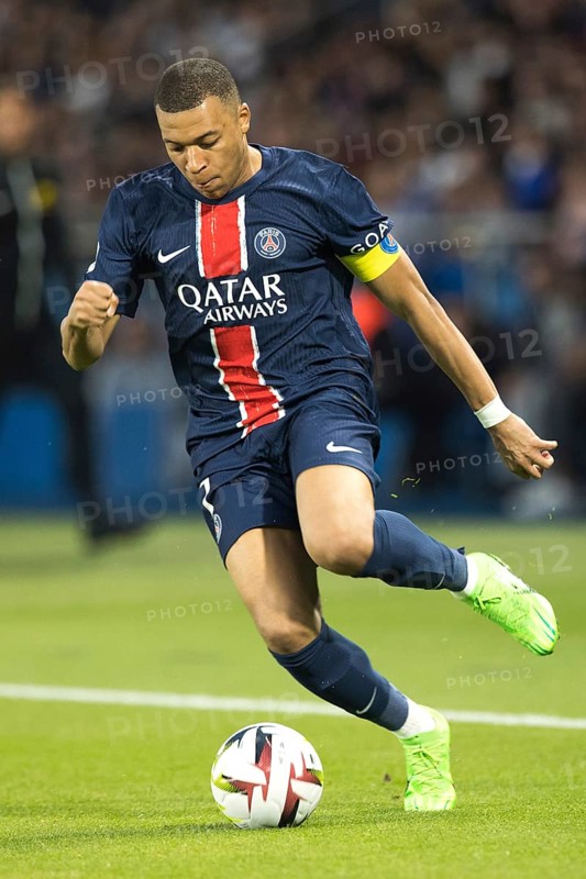 Football match, captain Kylian MBAPPE' Paris St Germain on the ball with his head down looking at the ball, Parc des Princes football stadium, Paris, France, Europe