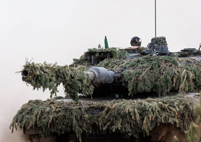 A soldier sits on a Leopard 2 main battle tank, taken during the NATO Steadfast Defender large-scale manoeuvre and the German part of the exercise, Quadriga 2024, in Pabrade, 29.05.2024