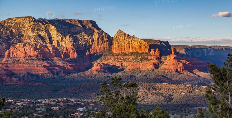 Evening sun lights up the red rock limestone formations surrounding Sedona, Arizona, USA, North America