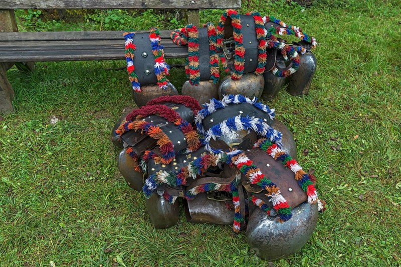 Cow jewellery bells, put together for the Almabtrieb, gabled house, Bad Hindelang, Allgaeu, Bavaria, Germany, Europe