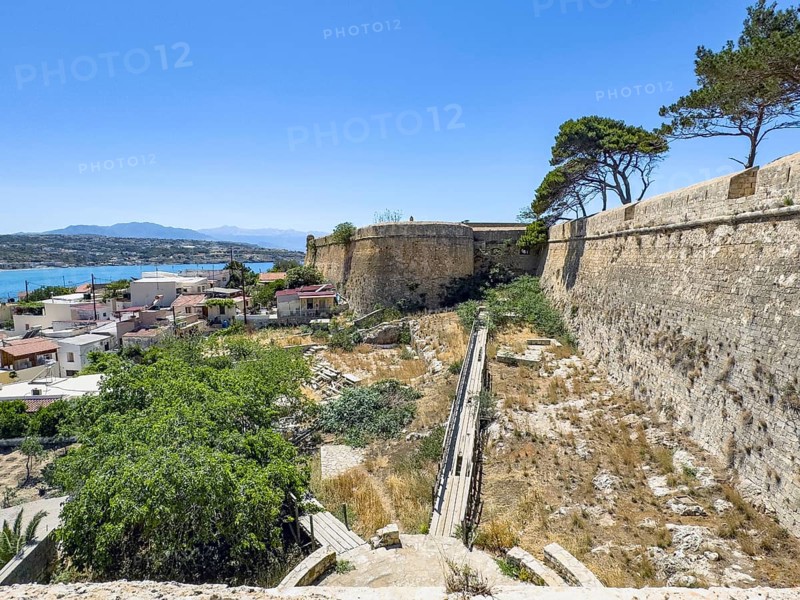 View of bastion Agios Loukas on southwest side of ruins of historical fortress Fortetza Fortezza of Rethymno built by Republic of Venice in 16th century in northwest of old town of Rethymno on rocky hill Paleokastro on north coast of island Crete, in background Mediterranean Sea, Rethymno, Crete, Greece, Europe