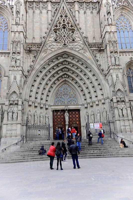 La Catedral de la Santa Creu i Santa Eulalia, Barri Gotic, Barcelona, Catalonia, Spain, Europe, The Gothic facade of a cathedral with intricate stone carvings and tourists at the entrance, Europe