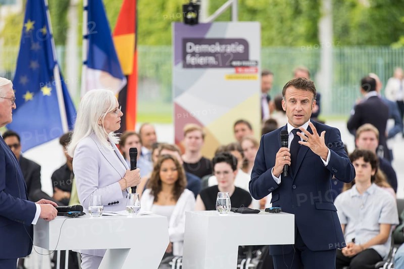 Emmanuel Macron (President of the French Republic) at the stage talk in the dialogue forum at Demokratie feiern. / The Basic Law turns 75, together it will be a celebration, Berlin, 26 May 2024