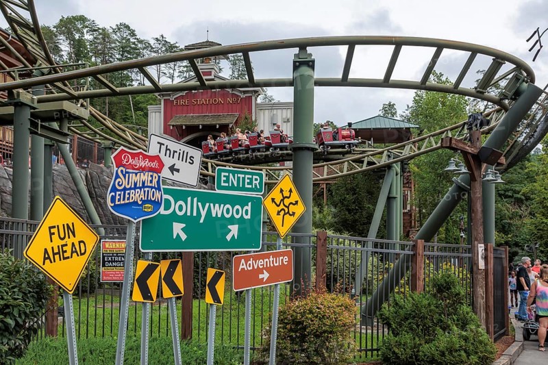 Road sign display for the Summer Celebrationin front of the FireChaser roller coaster ride in the Dollywood amusement park in Pigeon Forge, TN, United States of America, USA, North America
