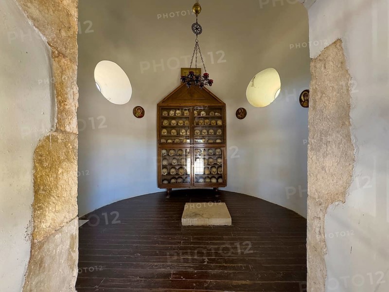 Historic ossuary with cabinet Showcase with old skulls skeletonised heads of monks from UNESCO World Heritage Site historic orthodox monastery Moni Arkadi Arkadi monastery from early Middle Ages, important national monument national shrine on the island of Crete, Arkadi, Armnatos, Crete, Greece, Europe