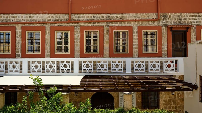 Synagogue, Kahal Shalom, Traditional building with many windows, surrounded by vegetation and a stone wall, Rhodes Old Town, Rhodes Town, Rhodes, Dodecanese, Greek Islands, Greece, Europe