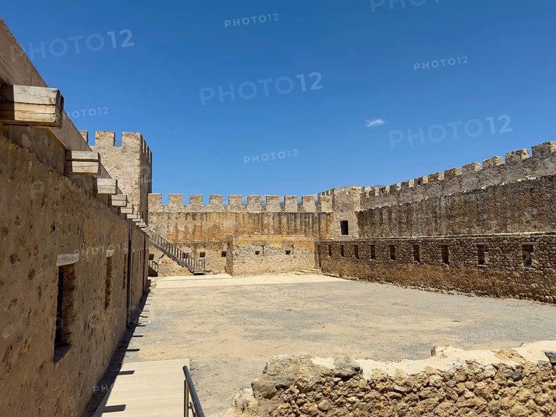 View of the inner courtyard of Fort Fortezza Fortetza Frangokastello, Venetian fort built by the Republic of Venice in the 14th century with walls and crenellated corner tower, Frangokastello, Sfakia, Crete, Greece, Europe