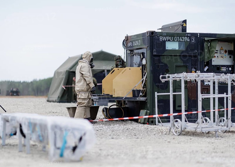 German soldiers from an NBC defence unit in protective clothing practise decontamination during the NATO Steadfast Defender large-scale manoeuvre in Pabrade, 29.05.2024