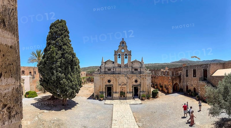 View of church Monastery church Transfiguration church dedicated to Saints Constantine and Helen and Transfiguration Christ the Saviour built from 1587 to 1600 in historic Arkadi Monastery from upper archway in building built in 1870 on site of west gate destroyed during siege by Ottomans Ottoman Empire in UNESCO World Heritage Site Orthodox Monastery Moni Arkadi Arkadi Monastery from early Middle Ages, important national monument national shrine on island of Crete, Arkadi, Armnatos, Crete, Greece, Europe