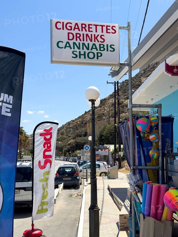 Sign advertising sign advertising at souvenir shop with lettering lettering reference to cigarettes cigarettes drinks drinks cannabis shop in former hippie place place for hippies and dropouts Matala, Matala, Crete, Greece, Europe
