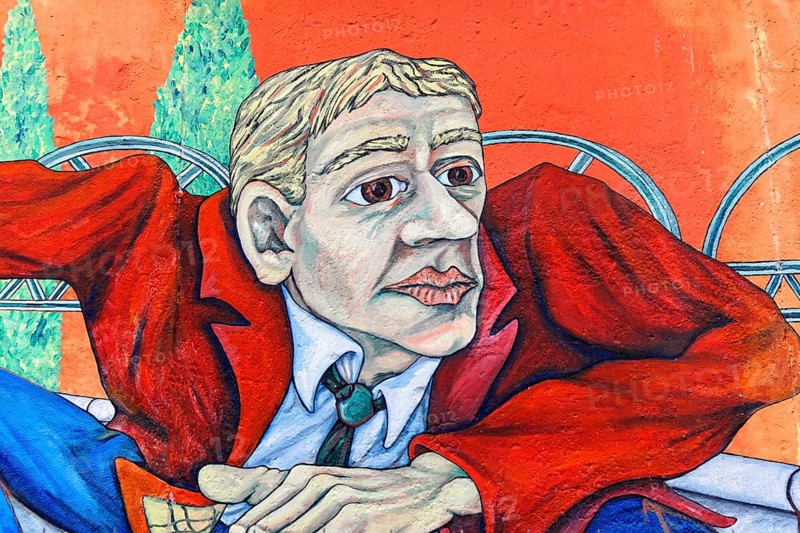 Realistic mural of a man in a red jacket against an orange background, Wall painting, East Side Gallery, Mauergalerie, Berlin, Germany, Europe
