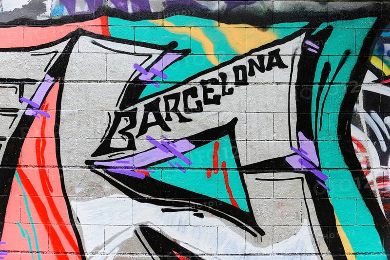 Barcelona, Catalonia, Spain, Europe, Abstract graffiti with the word 'Barcelona' on a colourful brick wall, Europe