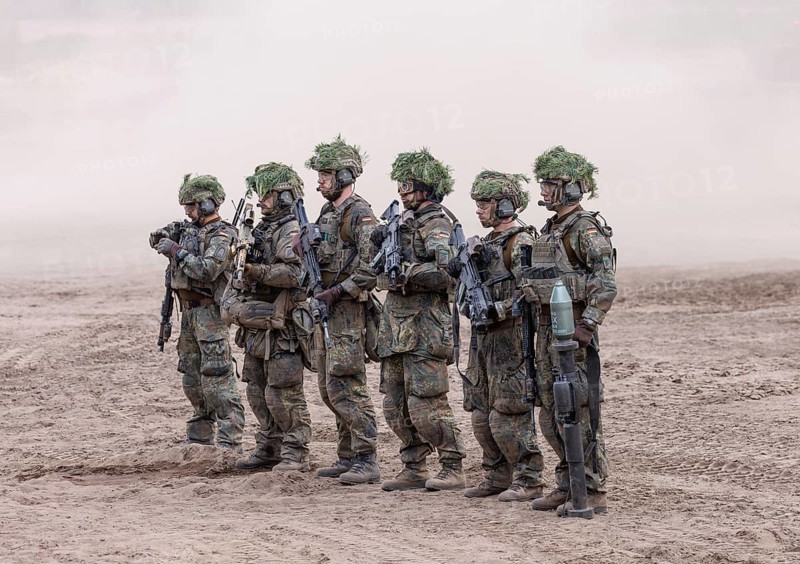 The crew of a Cougar infantry fighting vehicle presents itself at the NATO large-scale manoeuvre Steadfast Defender and the German part of the exercise, Quadriga 2024, in Pabrade, 29.05.2024