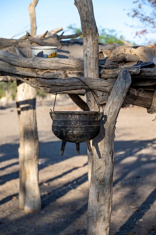 Kettle, cooking pot hanging on a wooden rack, Hakaone village, near Opuwo, Kunene, Namibia, Africa