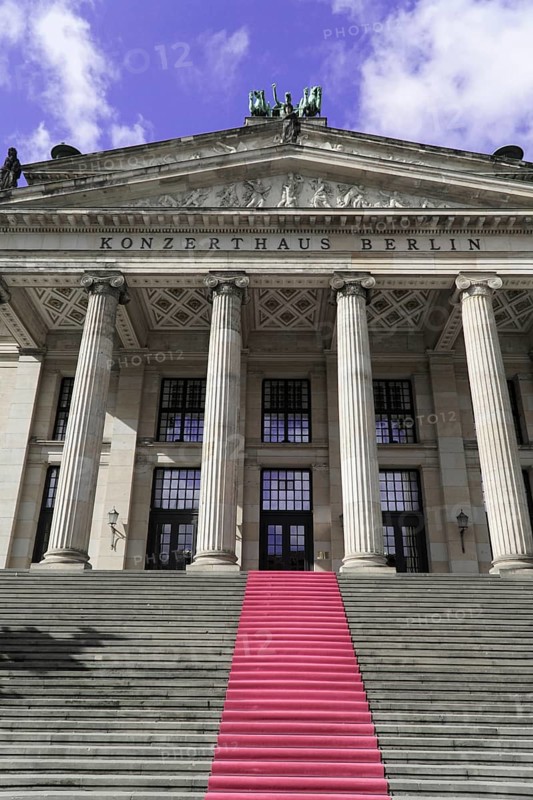 The concert hall am Gendarmenmarkt in Berlin, Germany, Europe, Entrance of a large building with high columns and stairs with red carpet, Berlin, Europe