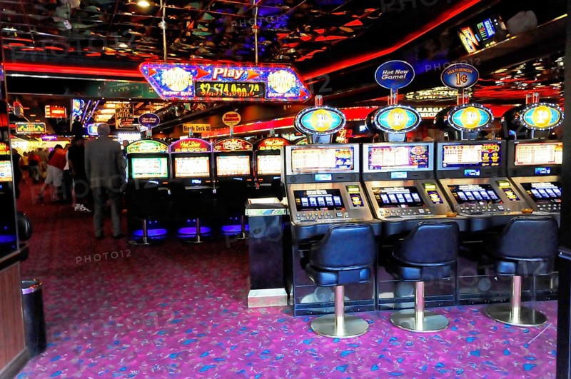Las Vegas, Nevada, USA, North America, Row of slot machines in a colourfully lit casino, Las Vegas Strip, North America