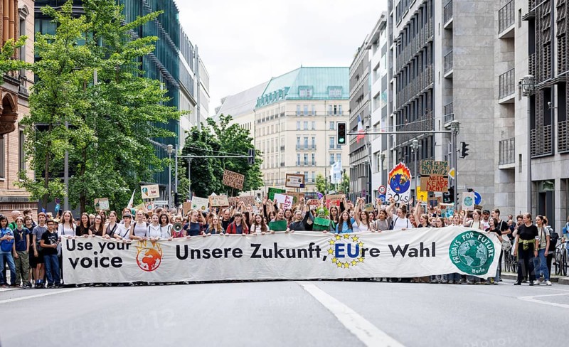 Demonstrators with signs at Fridays for Future, taken during the climate strike for the EU elections in Berlin, 31/05/2024