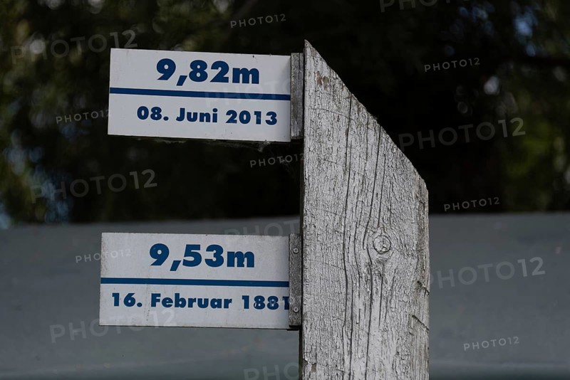 Wooden posts with flood marks and historical flood levels of the Elbe, Hohenwarthe, Saxony-Anhalt, Germany, Europe