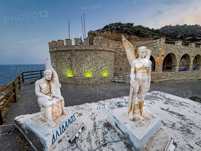 Photo taken at dusk evening mood of monument to Daedalus and Icarus on cliff of flight for flight from Crete of figures statues legendary figures of Greek mythology, in the background Libyan Sea Mediterranean, Agia Galini, Crete, Greece, Europe