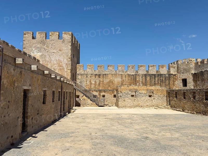View of the inner courtyard of Fort Fortezza Fortetza Frangokastello, Venetian fort built by the Republic of Venice in the 14th century with walls and crenellated corner tower, Frangokastello, Sfakia, Crete, Greece, Europe