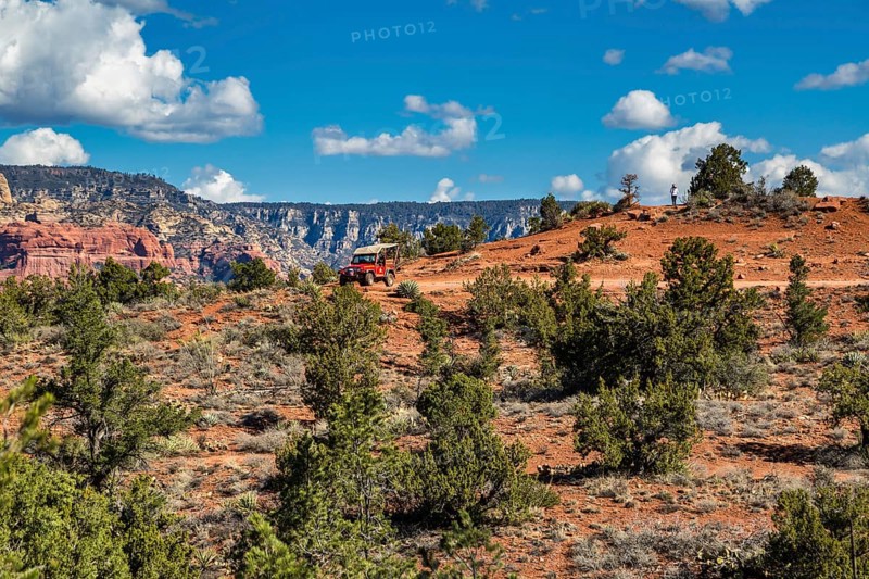 Tourists on Red Rock Jeep Tour look out over the valley in Sedona, Arizona, USA, North America