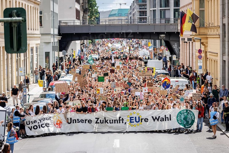 Demonstrators with signs at Fridays for Future, taken during the climate strike for the EU elections in Berlin, 31/05/2024