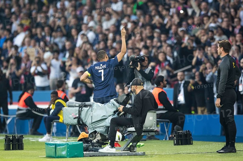Football match, captain Kylian MBAPPE' Paris St. Germain right has just scored the 1:0 for Paris St. Germain, he cheers and runs with raised right arm and index finger towards the main stand of the spectators, Parc des Princes football stadium, Paris, France, Europe