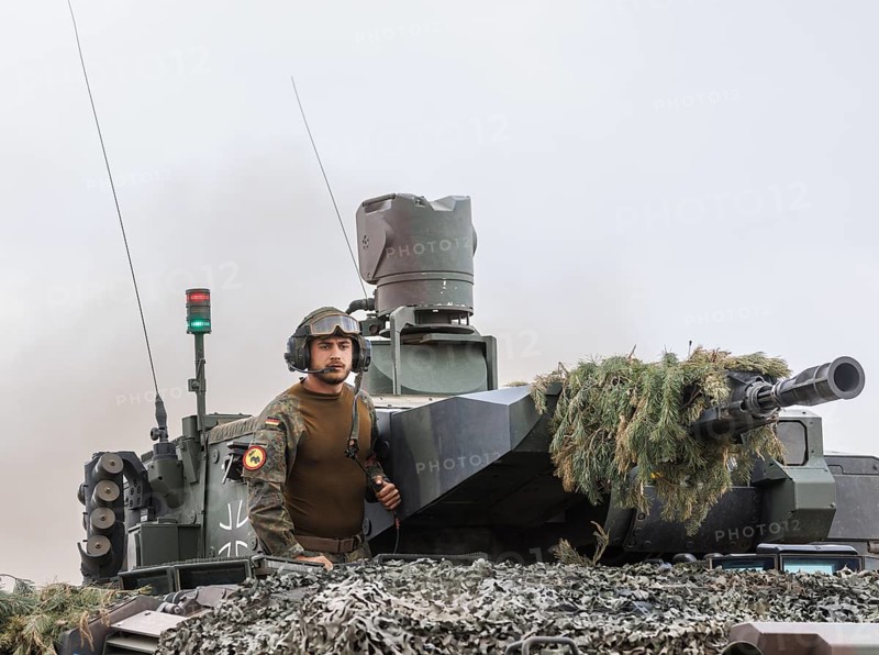 A soldier stands on a Cougar infantry fighting vehicle, taken during the NATO Steadfast Defender large-scale manoeuvre and the German part of the exercise, Quadriga 2024, in Pabrade, 29.05.2024