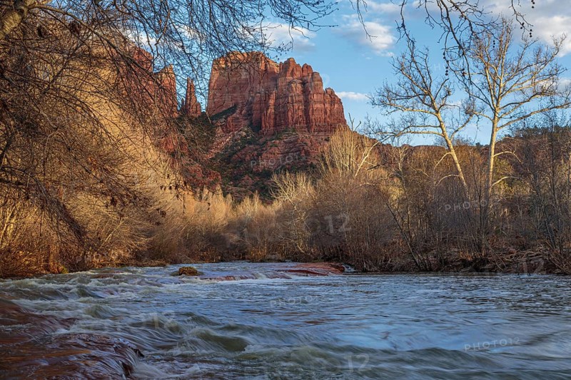 Cathedral Rock sandstone formations tower over Oak Creek at the Crescent Moon Picnic Site in Sedona, Arizona, USA, North America