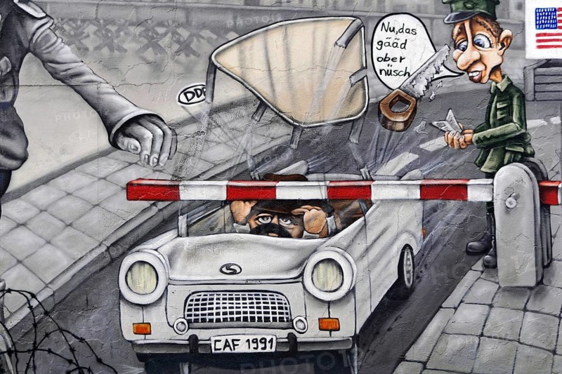 Detailed mural shows a caricature of soldiers at a checkpoint, car with humorous elements, mural, East Side Gallery, Mauergalerie, Berlin, Germany, Europe