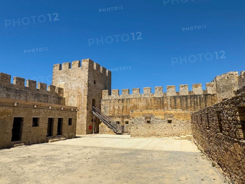 View of the inner courtyard of Fort Fortezza Fortetza Frangokastello, Venetian fort built by the Republic of Venice in the 14th century with walls and crenellated corner tower, Frangokastello, Sfakia, Crete, Greece, Europe