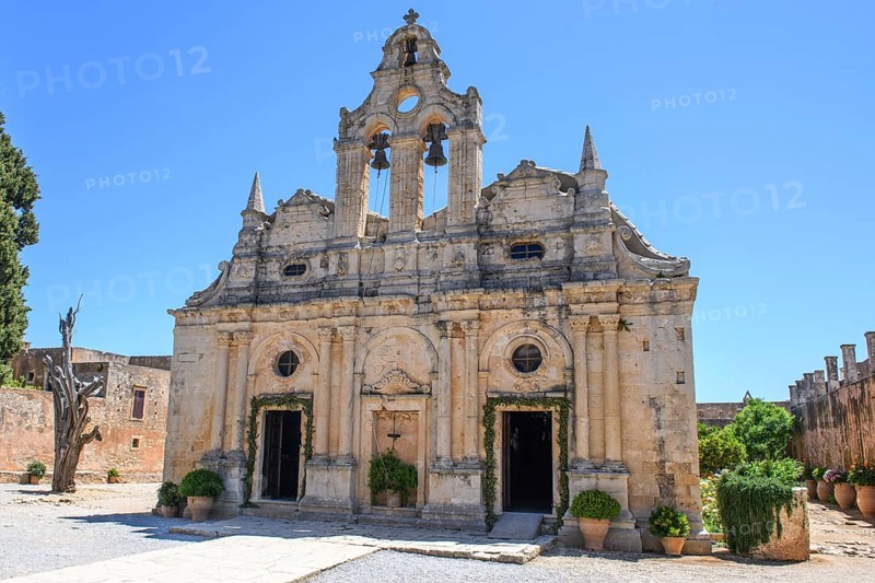 Facade with two doors Tor tor portals bells of two-aisled church built 1587 to 1600 in Arkadi Monastery today UNESCO World Heritage Site Orthodox Monastery of Moni Arkadi Arkadi Monastery from early Middle Ages, important national monument National Shrine on Crete Island, Arkadi, Armnatos, Crete, Greece, Europe