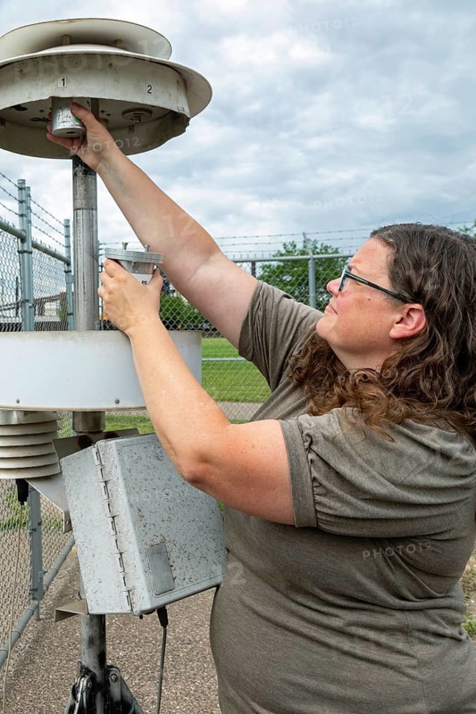 Dearborn, Michigan, Rebecca Robak, an environmental technician, checks air quality instruments at a monitoring station operated by Michigan's Department of Environment, Great Lakes, and Energy. (EGLE) .. The station, at Salina School, is in the heavily industrialized southwest Detroit area