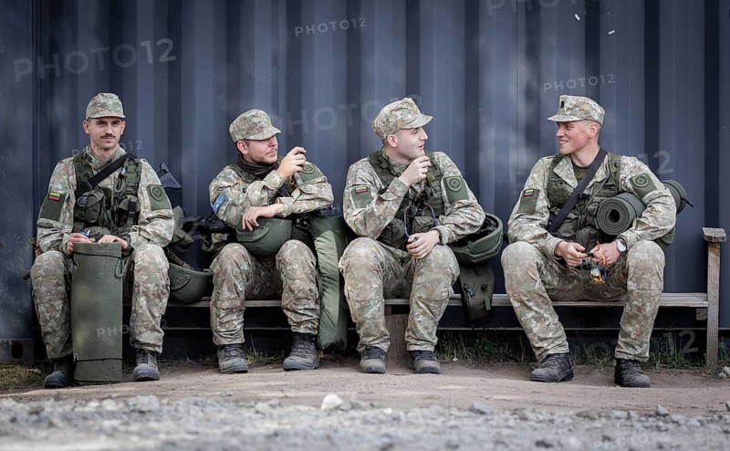 Young Lithuanian reserve soldiers take a lunch break during their training, taken in Rudninkai, 28/05/2024