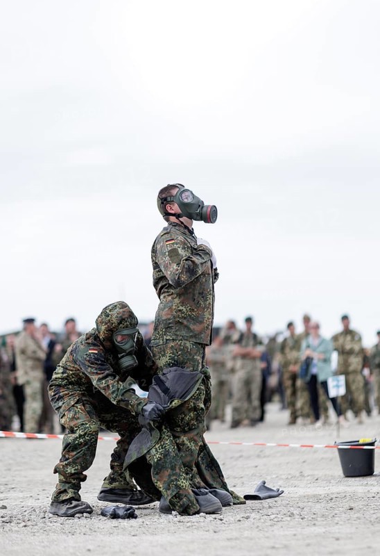 German soldiers from an NBC defence unit in protective clothing practise decontamination during the NATO Steadfast Defender large-scale manoeuvre in Pabrade, 29.05.2024