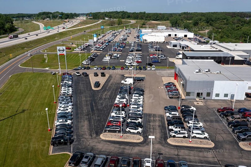 Jackson, Michigan, New car dealers along Interstate 94. From bottom: Nissan, Chrysler, Honda, and Chevrolet vehicles on sale
