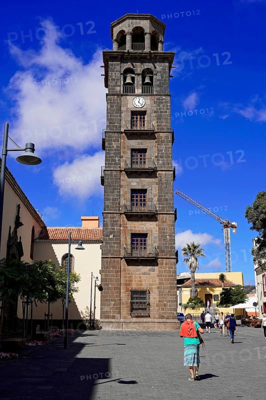 Bell tower of the church Iglesia de Nuestra Senora de la Concepcion, Old Town, San Cristobal de La Laguna, Tenerife, Canary Islands, Canary Islands, Spain, Europe, Historic stone bell tower with clock in front of a clear sky, Europe