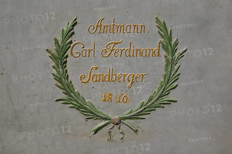 Detail of St George's Fountain, lettering on the octagonal cast iron trough from 1816, bailiff Carl Ferdinand Sandberger, letters, reference to the historical water supply, Boennigheim, Ludwigsburg district, Baden-Wuerttemberg, Germany, Europe