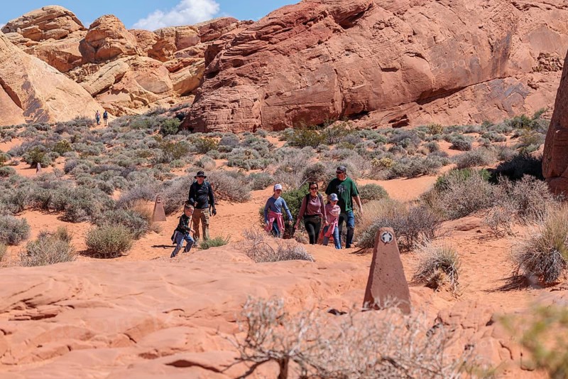 Family of hikers on the Fire Canyon Triin at Valley of Fire State Park near Overton, Nevada, United States of America, USA, North America