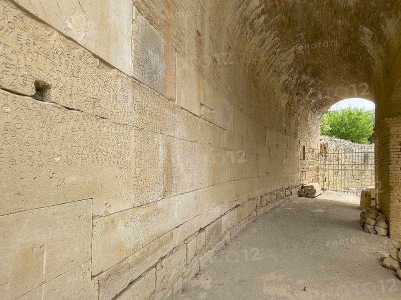 Wall of archway behind amphitheatre carved written chiselled laws City law of Gortys carved in stone Gortyn law book Large inscription, written in Doric dialect alternately from left to right and right to left, oldest discovered legal text in Europe, Gortyna, Crete, Greece, Europe